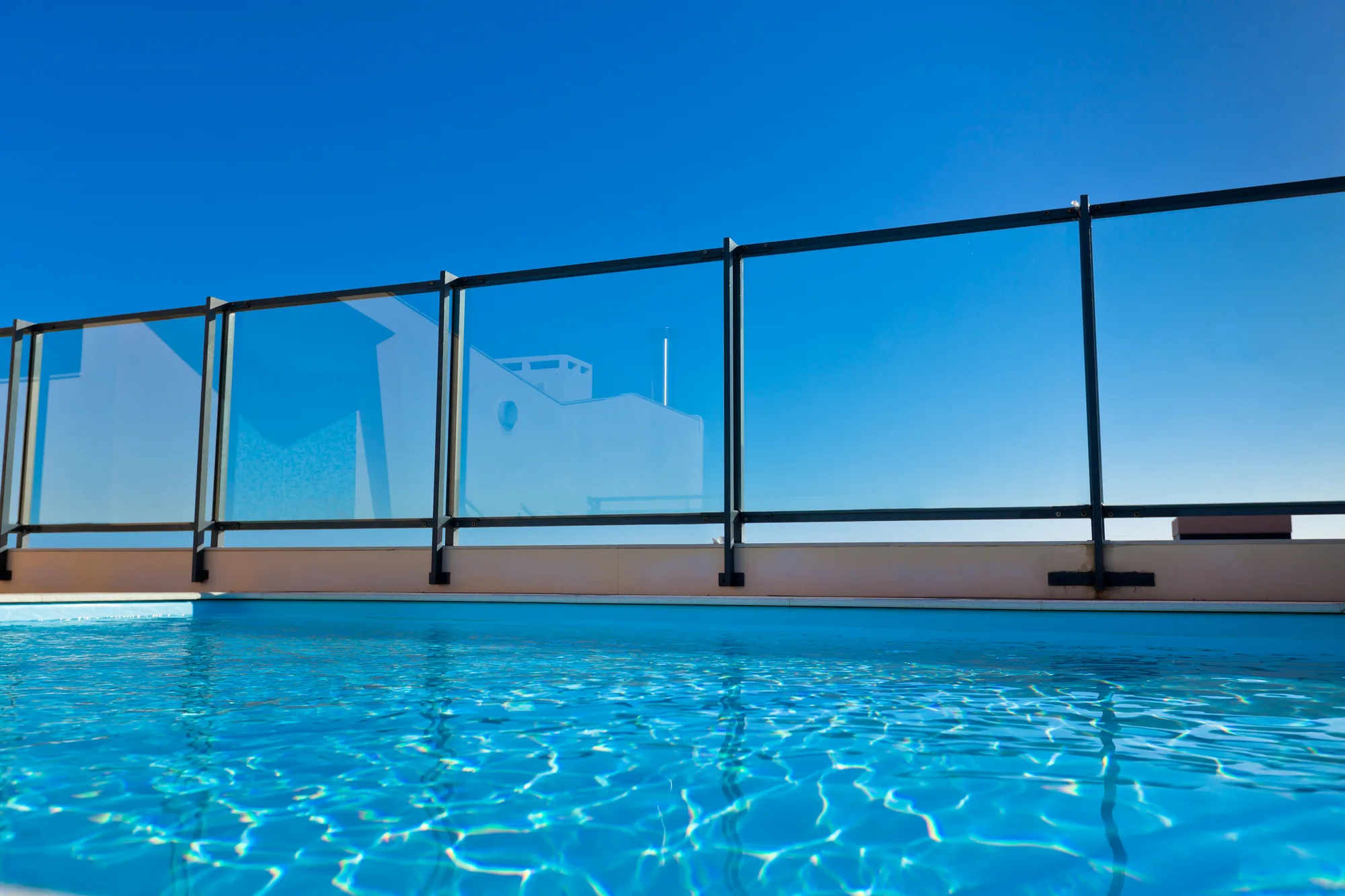 Semi-frameless glass pool fencing on a family home
