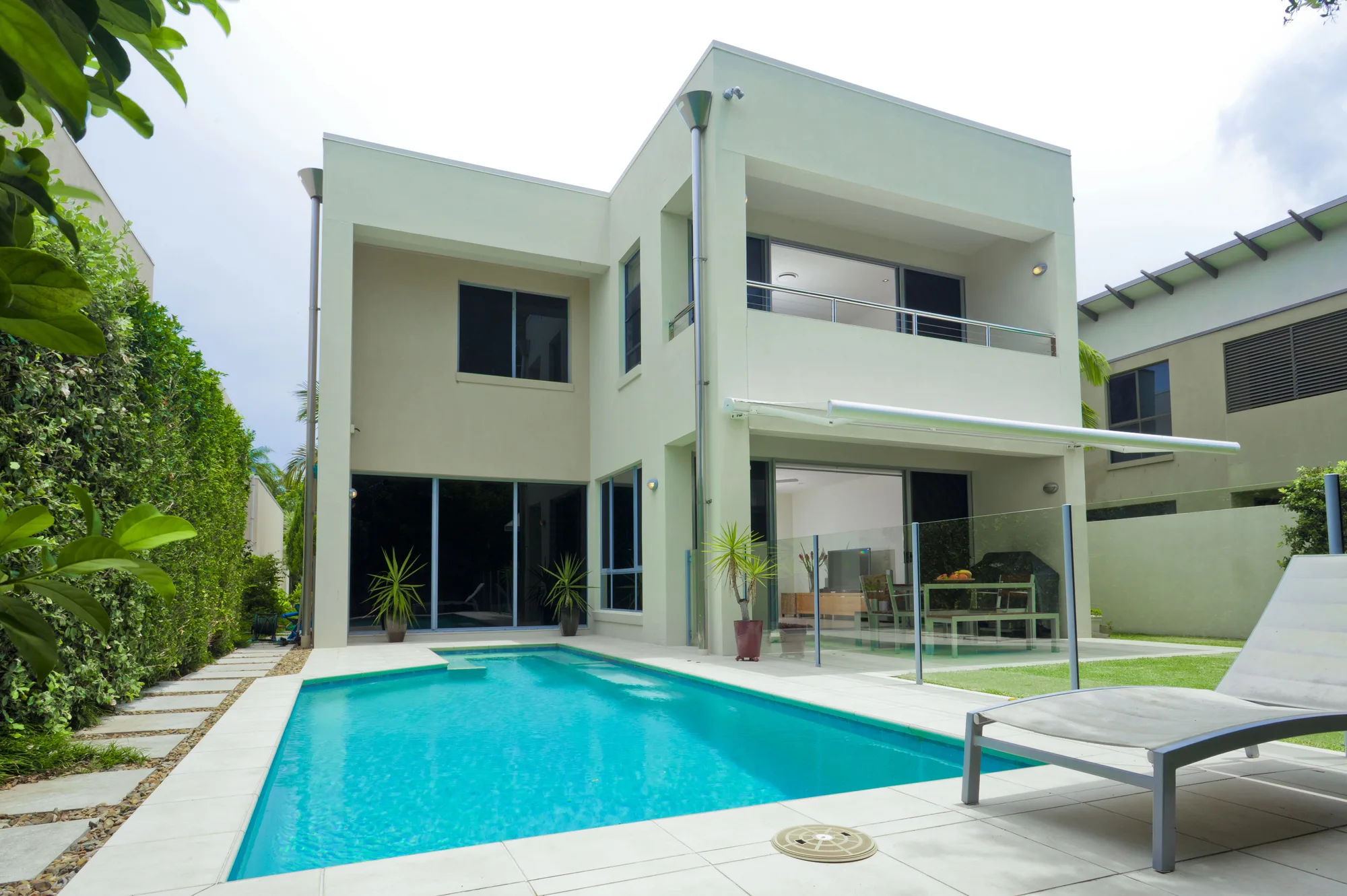 Glass pool fencing on a modern two-storey home